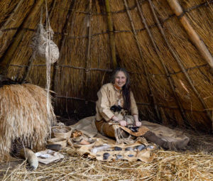 Volunteer Jo in our Mesolithic shelter
