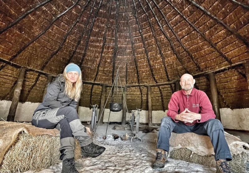 dr cat jarman in a roundhouse at butser ancient farm